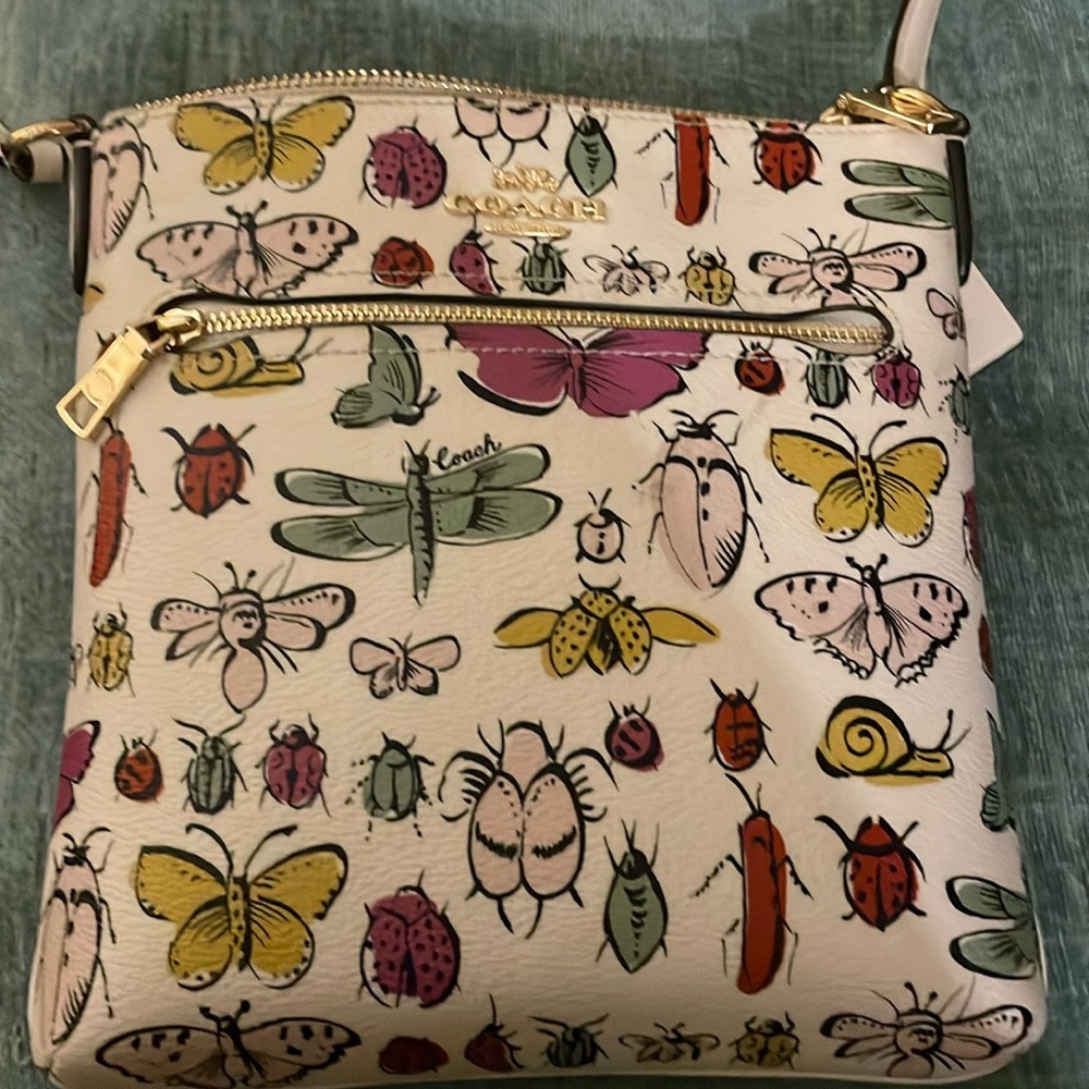 Lightly used Coach creature print wallet and file bag
